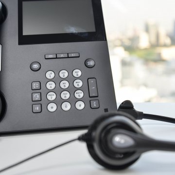 axvoice voip service overview headset black phone on desk